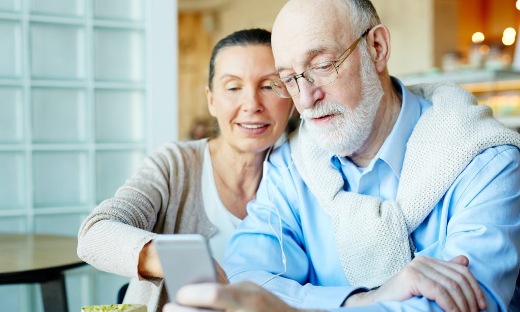 Senior couple using a cellphone